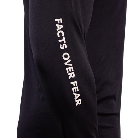 Closeup of sleeve of black Performance Hoodie showing white "FACTS OVER FEAR" text