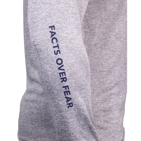 Closeup of sleeve of heather grey Performance Hoodie showing navy "FACTS OVER FEAR" text