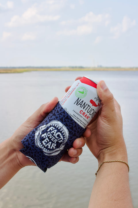 person putting drink into OCEARCH 12 OZ Can Cooler