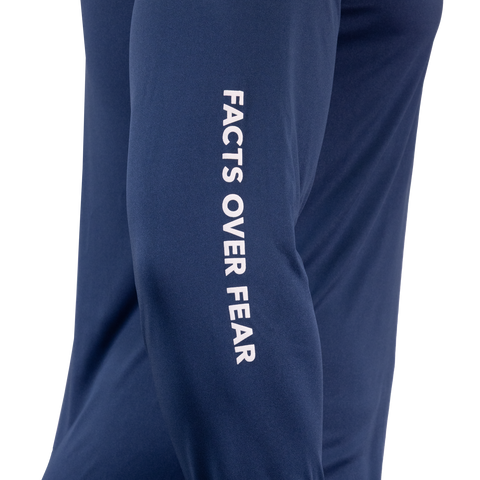 Closeup of sleeve of Navy Performance Hoodie showing white "FACTS OVER FEAR" text
