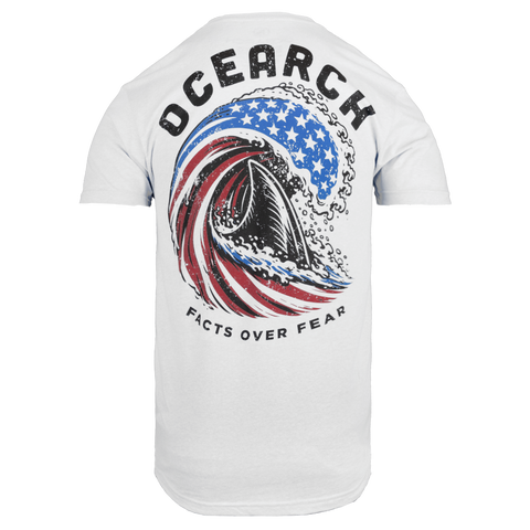 White tee with shark fin swimming in wave stylized as american flag with text "OCEARCH FACTS OVER FEAR"