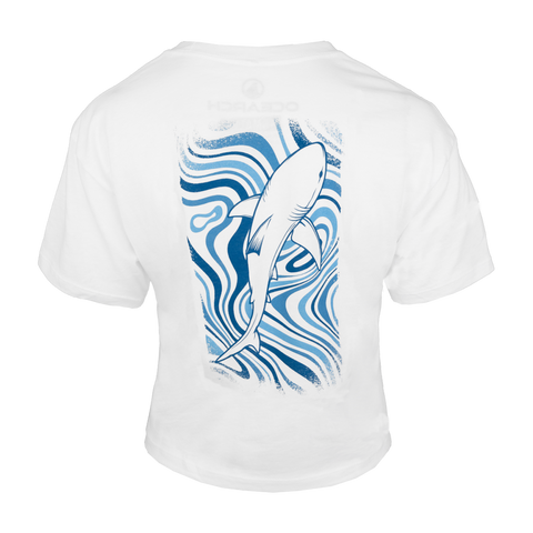 Rear view of white cropped tee with shark swimming through waves graphic