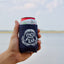 Hand holding OCEARCH 12 OZ Can Cooler with drink