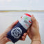 person putting drink into OCEARCH 12 OZ Can Cooler
