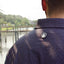 closeup of ocearch logo on back of paradise dark blue pattern buttondown