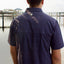 Rear view of man wearing paradise dark blue pattern buttondown
