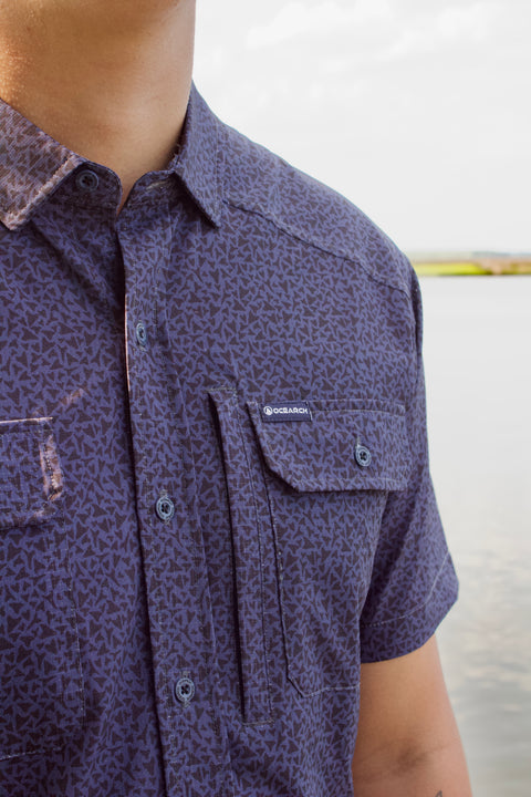 closeup of ocearch label on chest pocket of paradise dark blue pattern buttondown
