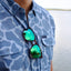closeup of sunglassing hanging from light blue Ocearch camo shirt