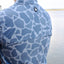 rear view of man in light blue Ocearch camo shirt showing ocearch logo on back