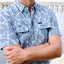 man wearing light blue Ocearch camo shirt