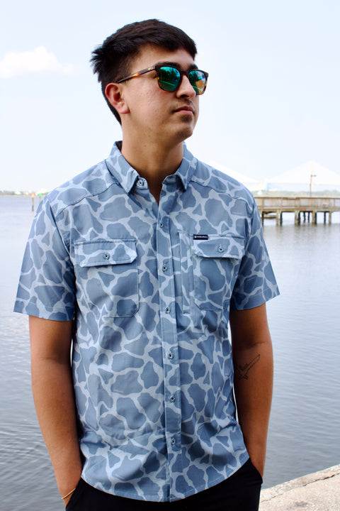 Man in light blue Ocearch camo shirt