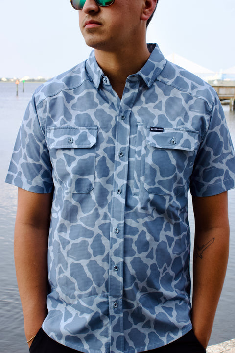 Man in light blue Ocearch camo shirt