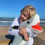 Child holding Ocearch Shark Plushie