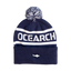 Navy / White pom beanie with "OCEARCH" text on beanie and Shark on cuff