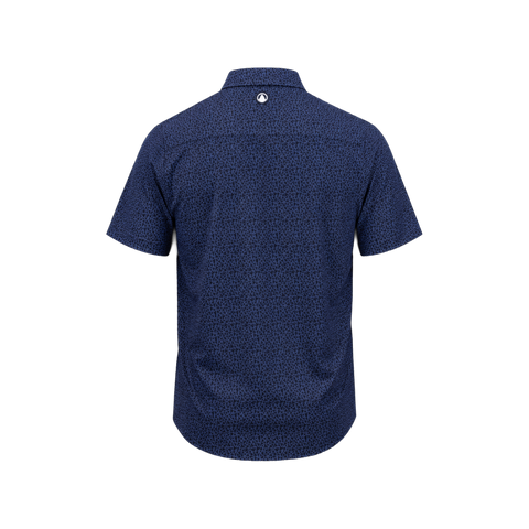 A short-sleeve polo shirt shown from the back, featuring a dark navy blue base with a fine, light micro-pattern throughout. A small circular white logo is visible on the upper back collar area.