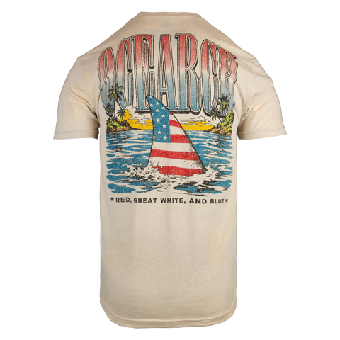Rear view of Cream tee with shark fin swimming in bay graphic with text "OCEARCH RED, GREAT WHITE, AND BLUE"